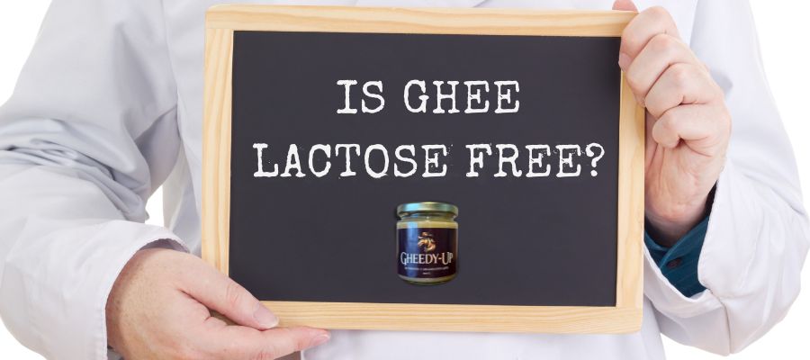 Doctor holding a sign asking “Is Ghee Lactose Free?” with a jar of Gheedy-Up, authentic Canadian ghee that is naturally lactose-free.
