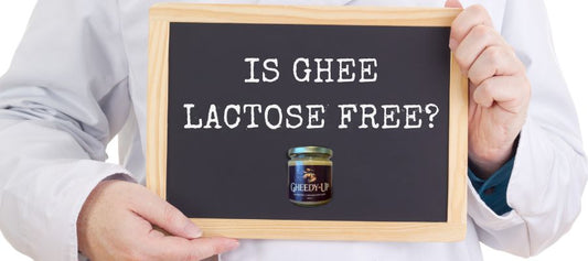 Doctor holding a sign asking “Is Ghee Lactose Free?” with a jar of Gheedy-Up, authentic Canadian ghee that is naturally lactose-free.